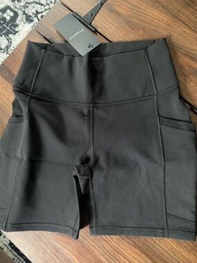 Fabletics Black High-Rise Bike Shorts with Side Pockets